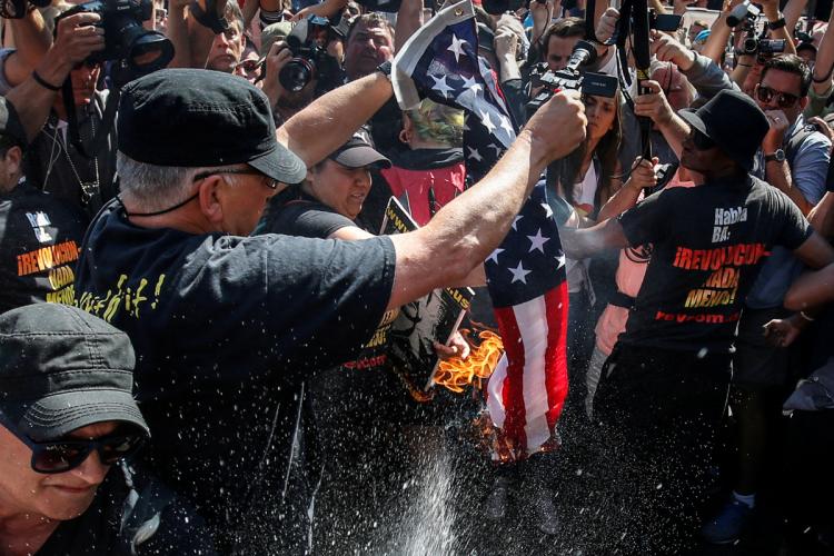 Communists Arrested After Burning American Flag