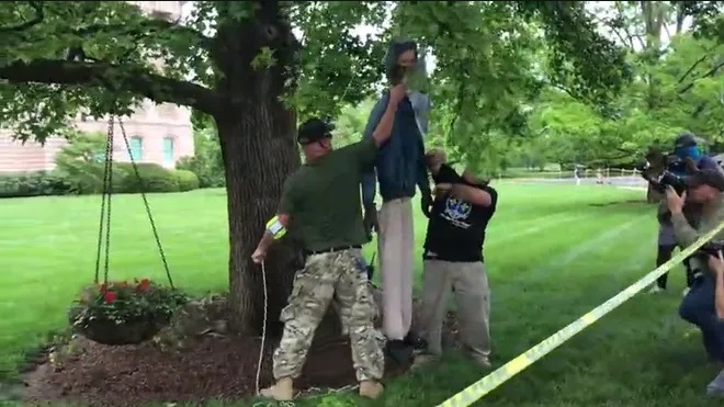 Right-Wing Protestors Condemned For Hanging Effigy Of Governor From A Tree