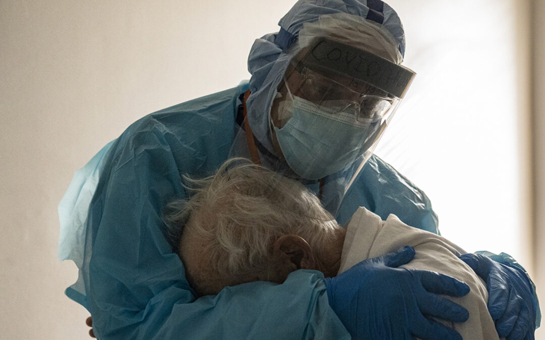 Photo Of The Year: Doctor Hugs Lonely Coronavirus Patient On Thanksgiving