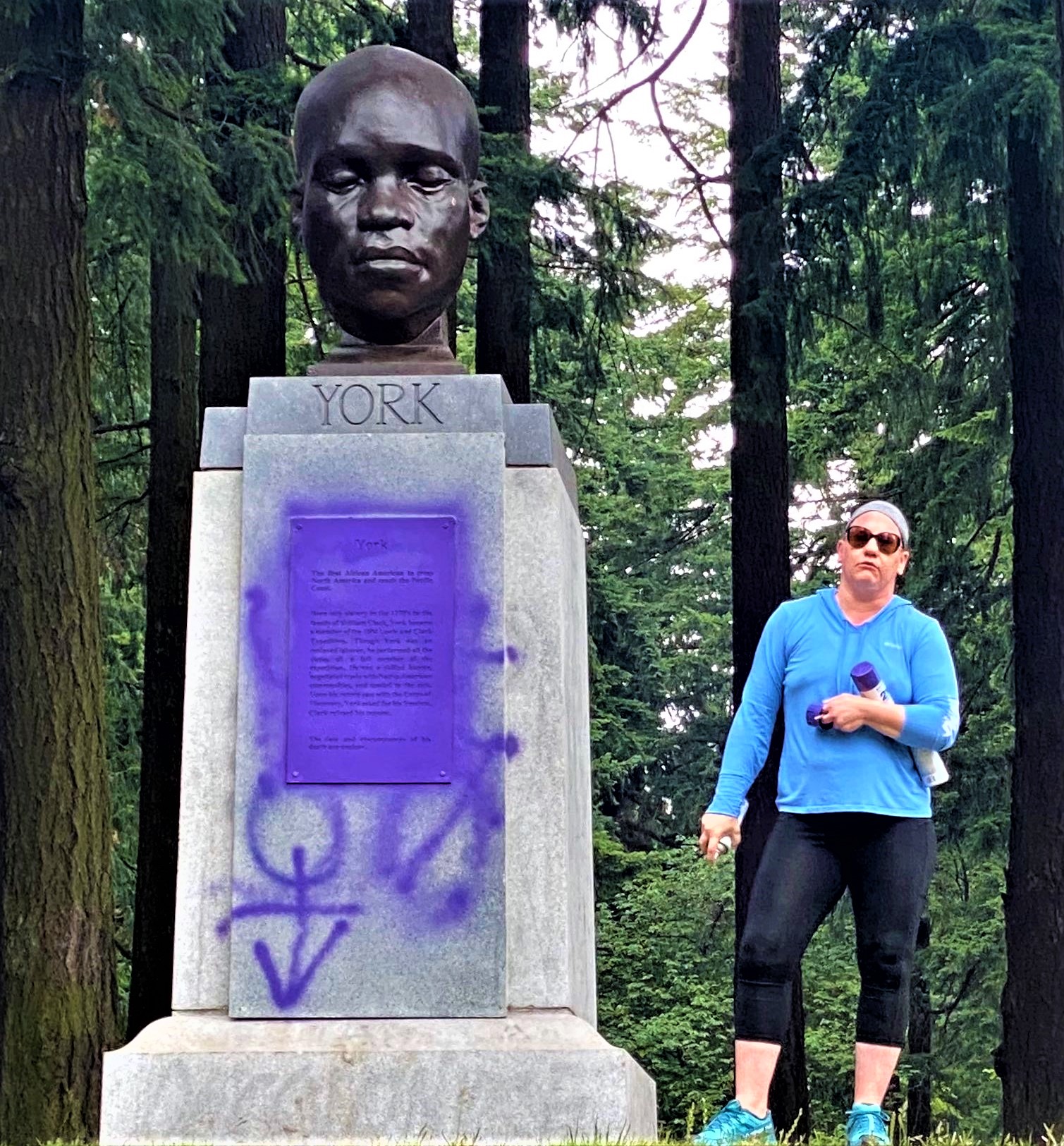 WATCH: White Woman Vandalizes Statue Of Only Black Member Of Lewis